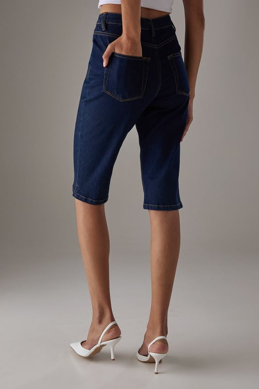 Classic knee-length denim capri with a clean, streamlined silhouette
        High-rise waistband for a flattering fit and comfortable coverage
        Traditional five-pocket styling with visible contrast stitching
        Straight-cut leg design with a neat, finished hem
        Crafted from 100% cotton for breathable comfort and durability
    
    These versatile denim capris from Warehouse strike the perfect balance between casual comfort and refined style. The high-rise design creates a sleek silhouette that pairs beautifully with both fitted and oversized tops. Style them with a crisp white crop top and an oversized leather jacket for an effortlessly cool daytime look, or dress them up with a silky blouse and pointed heels for evening drinks. The straight-cut leg offers a timeless appeal that works wonderfully for family gatherings or weekend brunches. These capris transition seamlessly between seasons - wear them with trainers and a light jumper for cooler days or with sandals and a floaty top when temperatures rise. Their durable cotton construction ensures they'll remain a wardrobe staple for years to come.