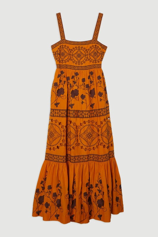 Get summer ready in our midaxi dress, with embroidered floral detailing, a straight neckline that accentuates the bust, a fit and flare silhouette which flatters every silhouette, and a cut out feature in the back. Pair it with strappy sandals for an elevated daytime look, perfect for summer days and holidays. Floral & Geo Embroidered Woven Midaxi High Quality Embroidered Detailing Universally Flattering Fit and Flare Silhouette Straight Neckline Statement Cut Out in Back Dramatic, Long Length Button Fastening in BackDiscover this seasons floral dresses or browse the full collection of women's dresses now.
