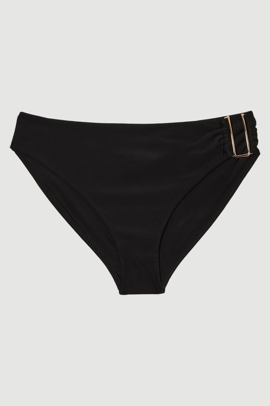 These sophisticated Karen Millen bikini bottoms bring a touch of luxury to your beachwear collection. The striking gold trim adds a refined accent that catches the light beautifully as you lounge poolside or stroll along the shore. Pair with the coordinating bandeau top for a cohesive look that's perfect for your summer getaway. Style with oversized sunglasses and a flowing kaftan for elegant poolside glamour, or team with a linen shirt and sandals when heading to a beachside lunch. These bottoms offer the perfect balance of comfort and sophistication for your next sun-soaked holiday.   Distinctive gold-tone trim detail on the side Mid-rise design offering comfortable coverage and a flattering silhouette Soft, stretchy fabric Sleek, minimalist design that pairs beautifully with the matching bandeau top  Matching piece sold separately.