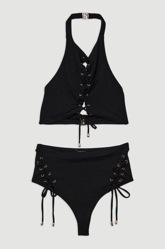 Get holiday ready in our bikini bottoms, with stitched detailing at the sides, and a full coverage design. Pairs perfectly with the matching top, sandals, and sunglasses for a holiday look perfect for lounging in the sun. Slinky Tie Detail Cheeky Bikini Bottoms Stitch Detailing at Hips Comfortable, Full Coverage Design Comfortable, High Waistline Matching Top Sold Separately Whilst appropriate for a beach destination, please note that in order to ensure enduring quality, this piece is not recommended for swimming.