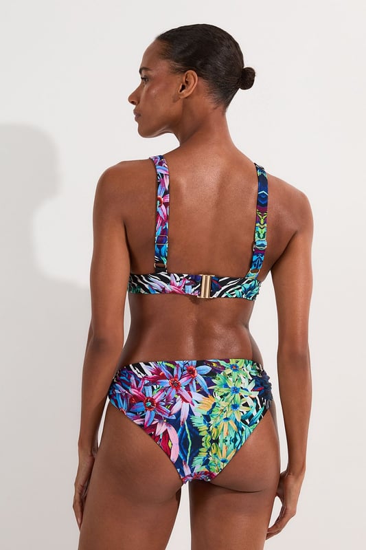 Make a statement this summer with these eye-catching tropical floral bikini bottoms from Karen Millen. The vivid print captures the essence of an exotic paradise, perfect for those sun-soaked days by the sea or poolside lounging. Pair with the matching top for a coordinated look, or mix and match with a solid-coloured piece for a personalised style. These versatile bottoms are ideal for a range of summer activities, from lazy beach days to active water sports. The stretchy fabric ensures comfort and a flattering fit, allowing you to move with confidence whether you're taking a dip or strolling along the shore. Embrace the tropical vibes and make these bikini bottoms your go-to choice for any sunny getaway or local beach day.  Vibrant tropical floral print for a bold beach look Stylish side strap detailing adds a touch of allure Mid-rise fit for comfortable coverage Stretchy fabric ensures a perfect fit and ease of movement Coordinating bikini top available for a complete set   Matching piece sold separately.