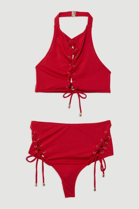 Get holiday ready in our bikini bottoms, with stitched detailing at the sides, and a full coverage design. Pairs perfectly with the matching top, sandals, and sunglasses for a holiday look perfect for lounging in the sun. Slinky Tie Detail Cheeky Bikini Bottoms Stitch Detailing at Hips Comfortable, Full Coverage Design Comfortable, High Waistline Matching Top Sold Separately Whilst appropriate for a beach destination, please note that in order to ensure enduring quality, this piece is not recommended for swimming.