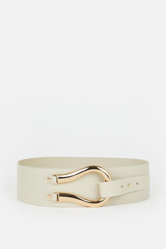Equestrian influences define this cinching waist belt, shaped with a Obi-inspired wide fit and featuring a slim tab that threads through the oversized horseshoe-style buckle. Layer this accessory over your edit of blazers, jersey tank tops, and flowing dresses for an elevated finish to every ensemble.Wide fitPolished buckleAdjustable lengthBrowse this seasons women's belts or discover the full range of women's accessories now.