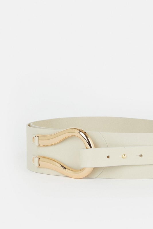 Equestrian influences define this cinching waist belt, shaped with a Obi-inspired wide fit and featuring a slim tab that threads through the oversized horseshoe-style buckle. Layer this accessory over your edit of blazers, jersey tank tops, and flowing dresses for an elevated finish to every ensemble.Wide fitPolished buckleAdjustable lengthBrowse this seasons women's belts or discover the full range of women's accessories now.