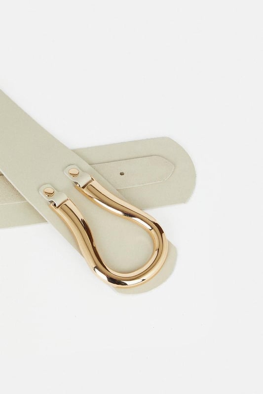 Equestrian influences define this cinching waist belt, shaped with a Obi-inspired wide fit and featuring a slim tab that threads through the oversized horseshoe-style buckle. Layer this accessory over your edit of blazers, jersey tank tops, and flowing dresses for an elevated finish to every ensemble.Wide fitPolished buckleAdjustable lengthBrowse this seasons women's belts or discover the full range of women's accessories now.