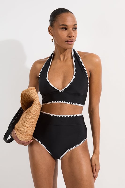 These Karen Millen high-waisted bikini bottoms high-rise design offers a timeless, sophisticated look whilst providing excellent coverage and support. Pair with the matching halter top for a coordinated ensemble that radiates poolside glamour. Perfect for lounging by the pool at exclusive resorts or enjoying coastal holidays, this swimwear piece transitions effortlessly from swimming to beachside dining when paired with a flowing kaftan and strappy sandals. This bikini set will become your go-to choice for sunny escapes and summer adventures.   High-waisted design Distinctive contrast stitch detailing Halter neck top with adjustable tie fastening Full coverage bottom  Matching piece sold separately.