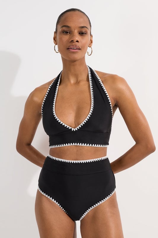 These Karen Millen high-waisted bikini bottoms high-rise design offers a timeless, sophisticated look whilst providing excellent coverage and support. Pair with the matching halter top for a coordinated ensemble that radiates poolside glamour. Perfect for lounging by the pool at exclusive resorts or enjoying coastal holidays, this swimwear piece transitions effortlessly from swimming to beachside dining when paired with a flowing kaftan and strappy sandals. This bikini set will become your go-to choice for sunny escapes and summer adventures.   High-waisted design Distinctive contrast stitch detailing Halter neck top with adjustable tie fastening Full coverage bottom  Matching piece sold separately.
