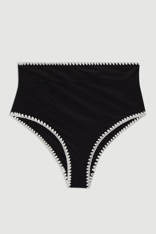 These Karen Millen high-waisted bikini bottoms high-rise design offers a timeless, sophisticated look whilst providing excellent coverage and support. Pair with the matching halter top for a coordinated ensemble that radiates poolside glamour. Perfect for lounging by the pool at exclusive resorts or enjoying coastal holidays, this swimwear piece transitions effortlessly from swimming to beachside dining when paired with a flowing kaftan and strappy sandals. This bikini set will become your go-to choice for sunny escapes and summer adventures.   High-waisted design Distinctive contrast stitch detailing Halter neck top with adjustable tie fastening Full coverage bottom  Matching piece sold separately.