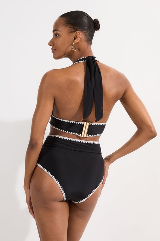 These Karen Millen high-waisted bikini bottoms high-rise design offers a timeless, sophisticated look whilst providing excellent coverage and support. Pair with the matching halter top for a coordinated ensemble that radiates poolside glamour. Perfect for lounging by the pool at exclusive resorts or enjoying coastal holidays, this swimwear piece transitions effortlessly from swimming to beachside dining when paired with a flowing kaftan and strappy sandals. This bikini set will become your go-to choice for sunny escapes and summer adventures.   High-waisted design Distinctive contrast stitch detailing Halter neck top with adjustable tie fastening Full coverage bottom  Matching piece sold separately.