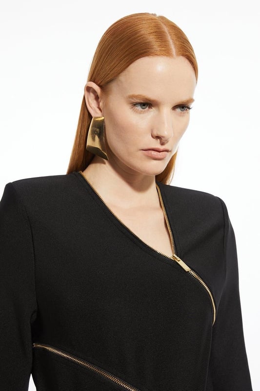 Elevate your top selection with our long sleeve top, with a figure hugging fit, and zip detailing that wraps around the body. This piece pairs well with anything, from matching separates, to tailored trousers, to jeans for an elevated look that will take you seamlessly from day to night. Asymmetric Zip Detail Figure Form Bandage Knit Top High Quality Knit Fabric Unique Zip Design Asymmetric V Neckline Fitted Silhouette Structured Shoulders Zip Back Fastening