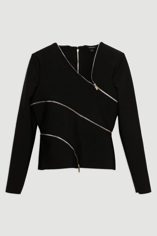 Elevate your top selection with our long sleeve top, with a figure hugging fit, and zip detailing that wraps around the body. This piece pairs well with anything, from matching separates, to tailored trousers, to jeans for an elevated look that will take you seamlessly from day to night. Asymmetric Zip Detail Figure Form Bandage Knit Top High Quality Knit Fabric Unique Zip Design Asymmetric V Neckline Fitted Silhouette Structured Shoulders Zip Back Fastening