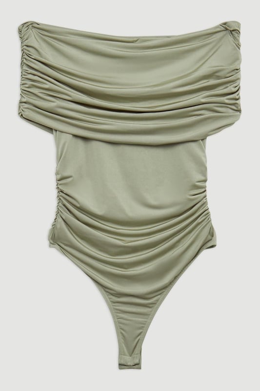 Elevate your every day wardrobe with a bodysuit, with a bodycon fit, a straight, bardot neckline which elevates the formality, and a textured, ruched design. Style it with tailored trousers or jeans and strappy heels for an occasion look that is guaranteed to turn heads wherever you step. Drapey Slinky Jersey Bardot Bodysuit High Quality, Soft Jersey Fabric Textured, Draped Design Ruched Detailing Formal Bardot Neckline Short, Off Shoulder Sleeves Bodycon Silhouette