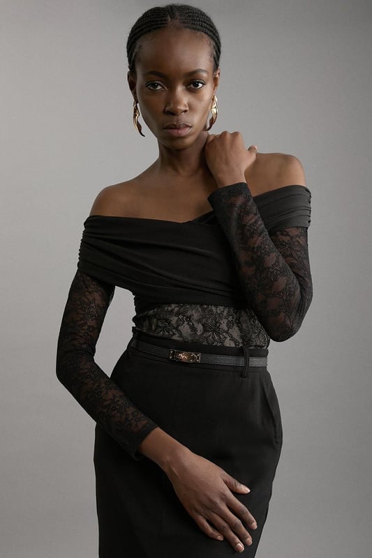 Elevate your occasion wear wardrobe with our bodysuit, with a figure hugging lace bodice and a ruched jersey overlay. The sweetheart, bardot neckline and keyhole back make for an elevated, statement occasion piece that is certain to turn heads. Style it with tailored trousers and strappy heels for an occasion look that is guaranteed to turn heads wherever you step. Lace And Jersey Crepe Bardot Bodysuit Statement Lace Bodice High Quality, Soft Jersey Overlay Figure Hugging Fit Off Shoulder, Bardot Neckline Ruched, Crossed Design Keyhole Back Accent