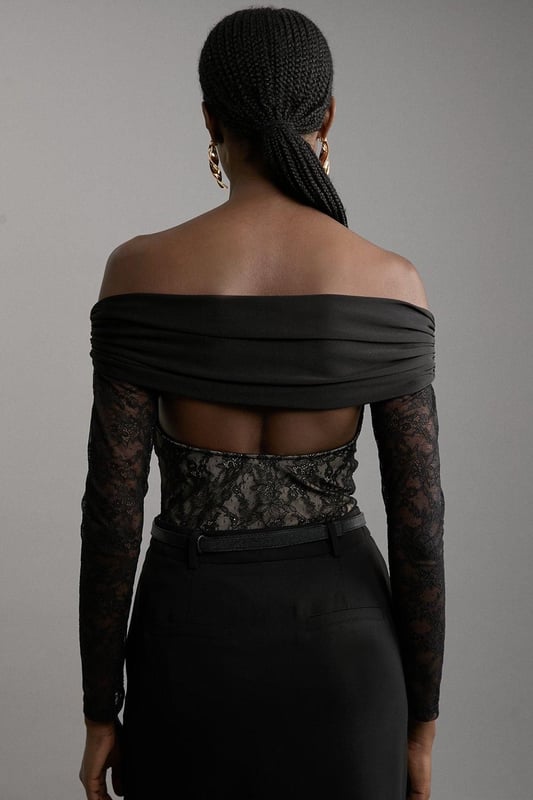 Elevate your occasion wear wardrobe with our bodysuit, with a figure hugging lace bodice and a ruched jersey overlay. The sweetheart, bardot neckline and keyhole back make for an elevated, statement occasion piece that is certain to turn heads. Style it with tailored trousers and strappy heels for an occasion look that is guaranteed to turn heads wherever you step. Lace And Jersey Crepe Bardot Bodysuit Statement Lace Bodice High Quality, Soft Jersey Overlay Figure Hugging Fit Off Shoulder, Bardot Neckline Ruched, Crossed Design Keyhole Back Accent