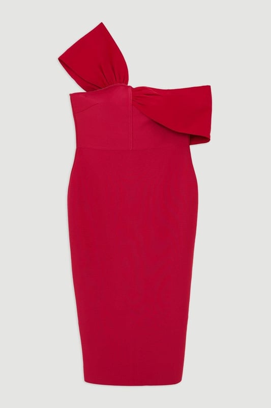 Experience opulence in our plus size midi dress, with a fitted silhouette, and an asymmetric strap design, with one that sits off the shoulder and one on the shoulder. Style it with strappy heels for an occasion look that will take you from wedding guest days to party nights. Plus Size Figure Form Bandage Knit Asymmetric Strap Midi Dress High Quality, Soft Knit Fabric Flattering Figure Hugging Fit Unique, Asymmetric Strap Detailing Thigh High Leg Split in Back Zip Fastening in Back Expertly designed for those UK size 18/US size 14 and above, our plus size clothing collection is perfectly proportioned to ensure you look stylish at every shape. Discover our collection of plus size midi dresses or browse our range of plus size clothing now.