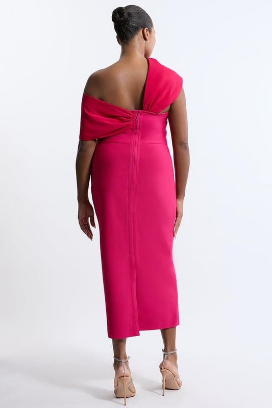 Experience opulence in our plus size midi dress, with a fitted silhouette, and an asymmetric strap design, with one that sits off the shoulder and one on the shoulder. Style it with strappy heels for an occasion look that will take you from wedding guest days to party nights. Plus Size Figure Form Bandage Knit Asymmetric Strap Midi Dress High Quality, Soft Knit Fabric Flattering Figure Hugging Fit Unique, Asymmetric Strap Detailing Thigh High Leg Split in Back Zip Fastening in Back Expertly designed for those UK size 18/US size 14 and above, our plus size clothing collection is perfectly proportioned to ensure you look stylish at every shape. Discover our collection of plus size midi dresses or browse our range of plus size clothing now.