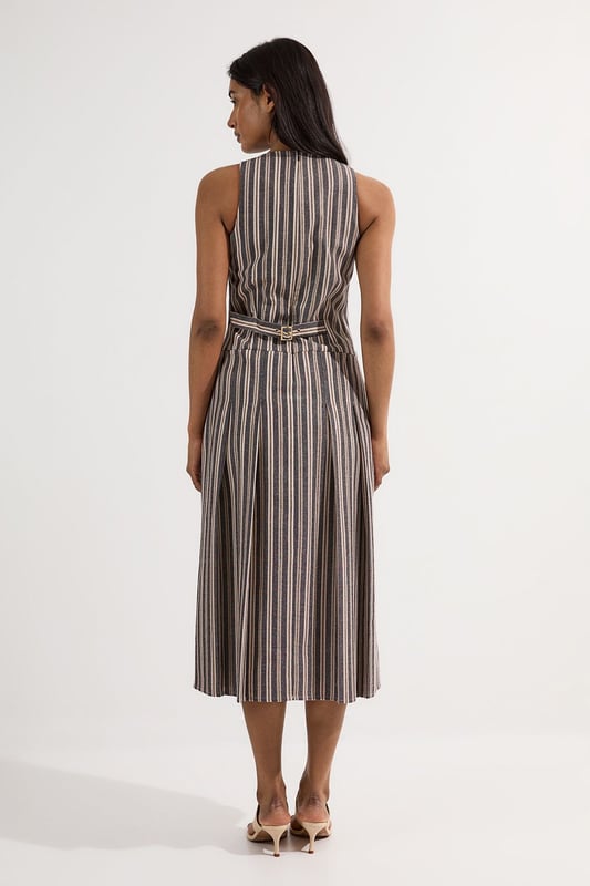 Tailored Stripe Linen Sleeveless Full Skirt Midi Dress This Karen Millen tailored midi dress combines timeless stripes with contemporary design for versatile daywear. The structured bodice flows into a beautifully pleated full skirt, creating a feminine silhouette that's both comfortable and sophisticated. Style with flat leather sandals as shown for casual family gatherings or weekend brunches. For garden parties, pair with espadrille wedges and a woven clutch. The cotton-linen blend fabric offers breathability and a natural texture perfect for warmer months. This dress transitions effortlessly from day to evening, simply swap your casual footwear for block heels and add delicate gold jewellery to complement the dress's hardware detailing. A lightweight cardigan makes this piece suitable for cooler summer evenings. Sleeveless midi dress with elegant vertical stripe pattern Sophisticated V-neckline for a flattering silhouette Full skirt design with structured pleating for graceful movement Tailored fit through bodice with defined waistline Decorative gold-tone buckle detail adds a refined finishing touch