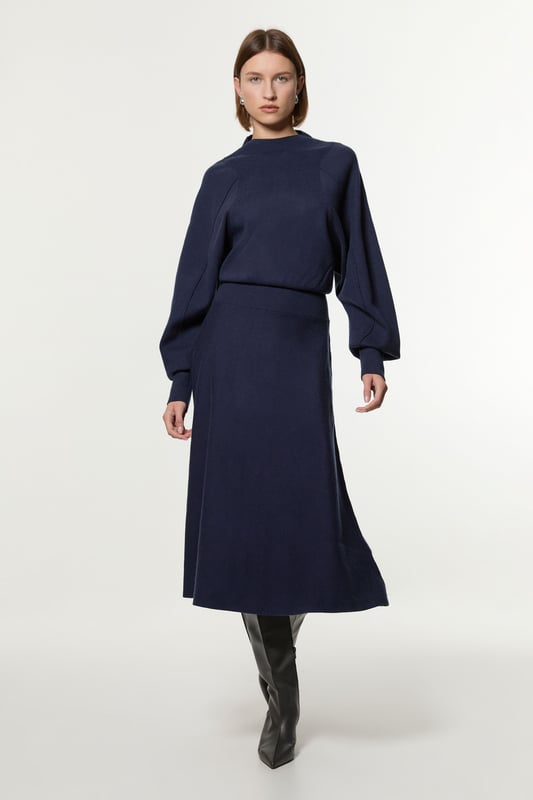 Introducing By Lydia: An Elegant Invitation - a new season collection with Lydia Millen, infused with sophistication and flair for the party season. Go seamlessly from day to night in our midi dress, made in soft knit fabric, featuring long sleeves, and a comfortable, relaxed fit that cinches at the waist to flaunt the figure. Style it simply with heeled boots or pointed toe heels for a look that will take you from date nights to upcoming parties and events. Lydia Millen Wool Look Rounded Sleeve Knit Midaxi Dress Seamless Knit Fabric Flattering Relaxed Silhouette Cinched Waistline Straight Hanging Skirt High Neckline