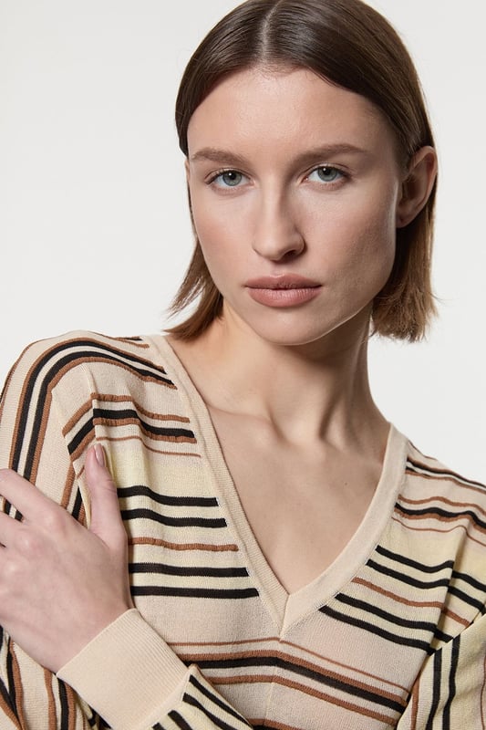 Lightweight knitted jumper with delicate stitch detailing Elegant V-neckline for a flattering silhouette Relaxed fit with dropped shoulders for effortless style Versatile design suitable for various daywear occasions Subtle texture adds visual interest to the garment  This Karen Millen lightweight knitted jumper is the epitome of casual sophistication. The delicate stitch detailing adds a touch of refinement to this everyday essential, while the V-neckline creates a flattering frame for your dcolletage. Perfect for those laid-back days when you want to look put-together without trying too hard. Style it with wide-leg trousers and a slim belt for a chic daytime ensemble, or pair it with your favourite jeans for a relaxed weekend look. The versatility of this jumper makes it ideal for family gatherings, brunch dates, or casual outings. Its lightweight nature allows for easy layering, making it a go-to piece for transitional weather. Remember to accessorise with minimalist jewellery to complement the jumper's understated elegance.