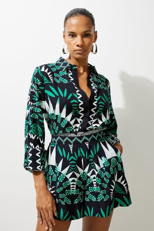 Feel warm weather ready in a pair of beach trousers, with lightweight fabric perfect for sunny days, and a relaxed fit ideal for laidback days by the pool. The geometric print makes a sunshine-approved statement, and they can easily be styled with the matching shorts or trousers and strappy sandals for a holiday outfit that goes seamlessly from day to night. Geometric Printed Viscose Woven Beach Shirt High Quality Viscose Fabric Flattering, Relaxed Fit Statement Geometric Print Rolled, Three Quarter Length Sleeves Button Front Fastenings Matching Pieces Sold SeparatelyDiscover this seasons shirts or browse the full collection of women's tops now.