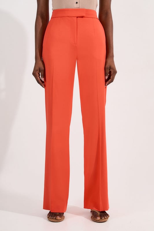 These Karen Millen tailored kick flare trousers present the perfect balance of contemporary style and classic workwear sophistication. The high-rise waistband creates a flattering shape that elongates the legs, while the subtle flare adds a modern twist to traditional office attire. Style them with a fitted button-front vest and coordinating blazer for a powerful suited look, or pair them with a crisp cotton shirt and court shoes for everyday elegance. The versatile design transitions seamlessly from important meetings to after-work gatherings, simply swap your structured tote for a clutch and add statement jewellery.  Tailored high-waisted design Kick flare shape Clean, minimalist styling Viscose-blend fabric
