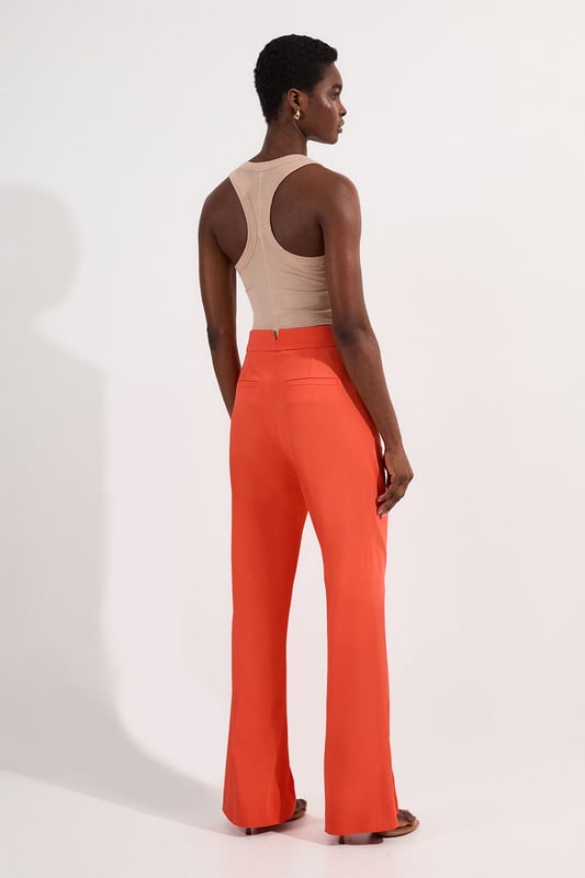 These Karen Millen tailored kick flare trousers present the perfect balance of contemporary style and classic workwear sophistication. The high-rise waistband creates a flattering shape that elongates the legs, while the subtle flare adds a modern twist to traditional office attire. Style them with a fitted button-front vest and coordinating blazer for a powerful suited look, or pair them with a crisp cotton shirt and court shoes for everyday elegance. The versatile design transitions seamlessly from important meetings to after-work gatherings, simply swap your structured tote for a clutch and add statement jewellery.  Tailored high-waisted design Kick flare shape Clean, minimalist styling Viscose-blend fabric