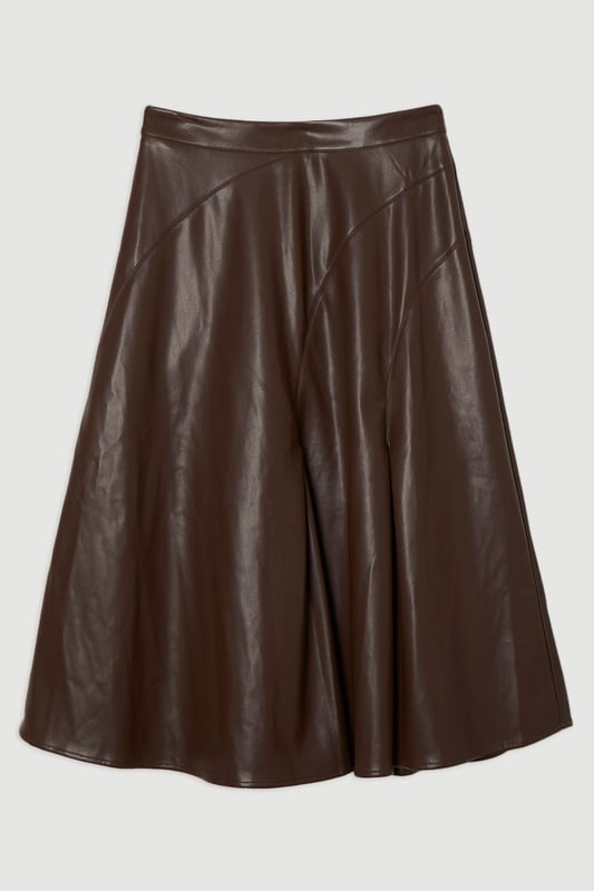 This Karen Millen faux leather midi skirt combines timeless elegance with contemporary edge. The full silhouette creates a dramatic swish with every step, while the high waistline accentuates your natural curves. Style with a fitted top for a balanced silhouette that highlights the skirt's voluminous design. For casual gatherings, pair it with a simple knit jumper and ankle boots, or dress it up with a crisp blouse and block heels for dinner dates. The versatile midi length works with both flats and heels, making this piece adaptable for family gatherings or weekend brunches. Add a cropped jacket and statement jewellery to transform this skirt into an ensemble that transitions effortlessly from day to evening wear.  Faux leather midi skirt with a full, flowing silhouette High-waisted design Elegant pleating detail Midi length Smooth finish with a subtle sheen