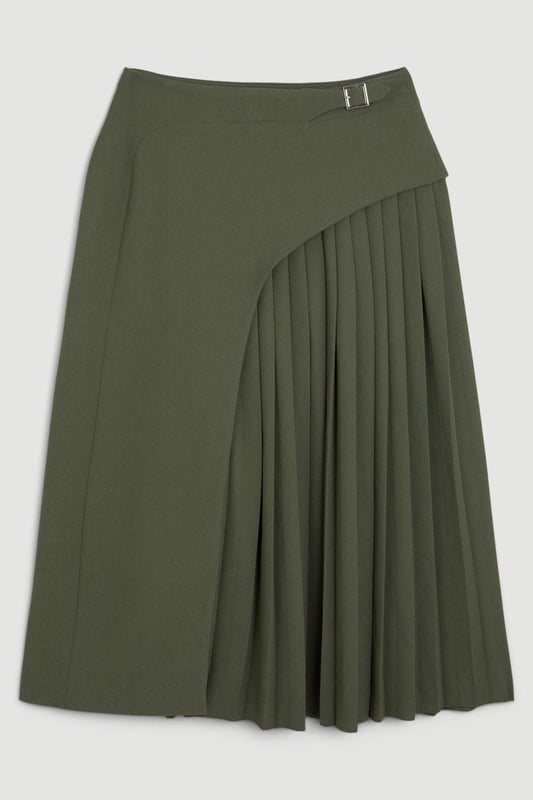 Feel elegant in our midi skirt, with a universally flattering silhouette, pleated detailing, and a high waistline, perfect for getting a little dressed up. Style this piece with strappy heels for an outfit that will turn heads from office days to upcoming occasions and events. Tailored Buckle Detail Pleated Midi Skirt Formal, Flowing Fit High Waistline Unique Pleated Panel Midi Length Metallic Buckle at WaistlineBrowse this seasons work skirts or discover the full range of workwear now.