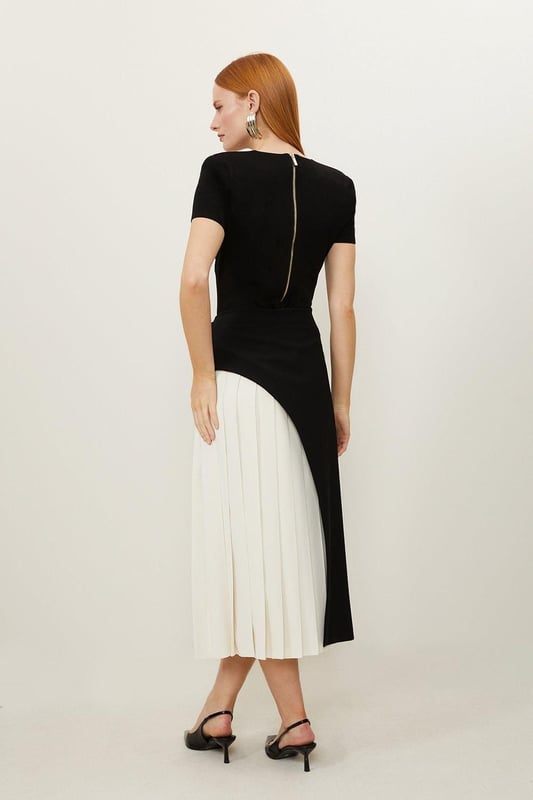 Feel elegant in our midi skirt, with a universally flattering silhouette, pleated detailing, and a high waistline, perfect for getting a little dressed up. Style this piece with strappy heels for an outfit that will turn heads from office days to upcoming occasions and events. Tailored Buckle Detail Pleated Midi Skirt Formal, Flowing Fit High Waistline Unique Pleated Panel Midi Length Metallic Buckle at WaistlineBrowse this seasons work skirts or discover the full range of workwear now.