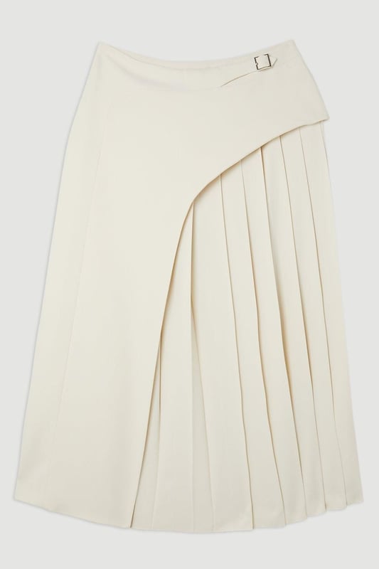 Feel elegant in our midi skirt, with a universally flattering silhouette, pleated detailing, and a high waistline, perfect for getting a little dressed up. Style this piece with strappy heels for an outfit that will turn heads from office days to upcoming occasions and events. Tailored Buckle Detail Pleated Midi Skirt Formal, Flowing Fit High Waistline Unique Pleated Panel Midi Length Metallic Buckle at WaistlineBrowse this seasons work skirts or discover the full range of workwear now.