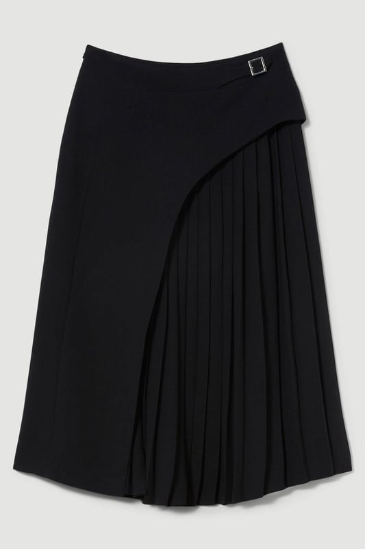 Feel elegant in our midi skirt, with a universally flattering silhouette, pleated detailing, and a high waistline, perfect for getting a little dressed up. Style this piece with strappy heels for an outfit that will turn heads from office days to upcoming occasions and events. Tailored Buckle Detail Pleated Midi Skirt Formal, Flowing Fit High Waistline Unique Pleated Panel Midi Length Metallic Buckle at WaistlineBrowse this seasons work skirts or discover the full range of workwear now.