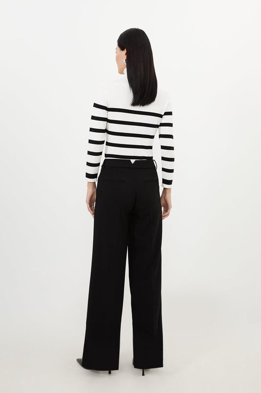 A capsule wardrobe piece that can be styled multiple ways, these trousers are cut in a modern straight leg design that hangs to the ankles with classic belt loops for practicality. Pair this piece with a matching blazer for a sleek workwear ensemble that can go from desk to dinner.Straight legBelt loopsTailored Browse this seasons suits now.