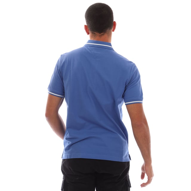 Mens Tommy Jeans Regular Fit Tipped Polo Shirt in blue.- Ribbed polo collar.- Two button placket.- Short sleeves with ribbed cuffs.- Contrast tipping at collar and cuffs- Embroidered Tommy Jeans flag patch at left chest.- Even vented hem.- Soft and comfortable cotton piqué fabric  made with at least 95% regenerative cotton.- Regular fit.- 100% Cotton.  Machine washable.- Ref: DM0DM20745C6E