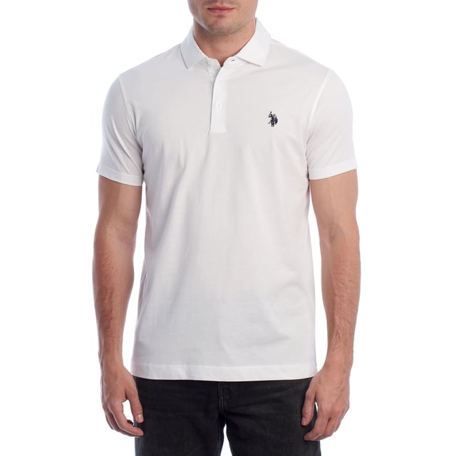 Inspired by the brand's sporting heritage, this US Polo Assn. polo offers a perfect blend of tradition and modernity. Designed for the man who values authenticity, its impeccable cut and embroidered details make it a contemporary wardrobe staple.

 Details:
 - Classic polo-style collar with three-button placket.
 - Short sleeves.
 - Minimalist design.
 - US Polo Assn. logo embroidered on the chest.
 - Regular cut that guarantees comfort and freedom of movement.
 - High quality soft and breathable cotton fabric.

 At US Polo Assn., every garment tells a story of authenticity, tradition, and sporty style. This men's polo shirt isn't just a staple: it represents the official heritage of the sport of polo and reflects our passion for quality, design, and casual elegance. Dress with identity, dress with history.
 Composition: 100% Cotton
 Care:
Machine wash cold (max. 30°C).
 Do not use bleach.
 Iron at low temperature if necessary.
 Air dry, avoid dryer.