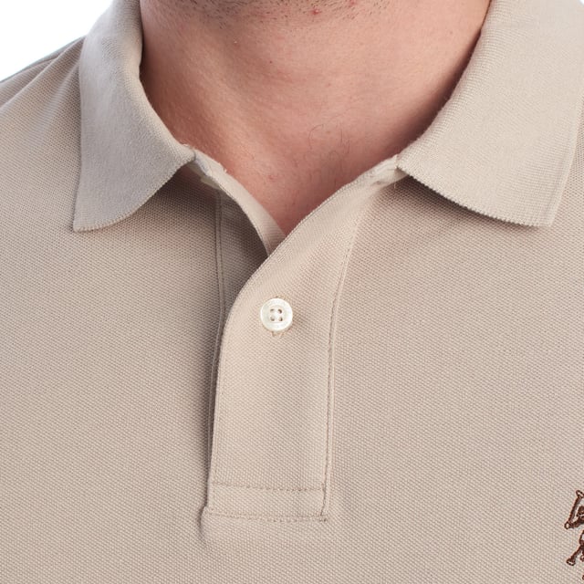 Inspired by the brand's sporting heritage, this US Polo Assn. polo offers a perfect blend of tradition and modernity. Designed for the man who values authenticity, its impeccable cut and embroidered details make it a contemporary wardrobe staple.

 Details:
 - Classic polo-style collar with two-button placket.
 - Short sleeves.
 - Piping detail on the inside of the neck.
 - US Polo Assn. logo embroidered on the chest.
 - Regular cut that guarantees comfort and freedom of movement.
 - High quality breathable piqué fabric.

 At US Polo Assn., every garment tells a story of authenticity, tradition, and sporty style. This men's polo shirt isn't just a staple: it represents the official heritage of the sport of polo and reflects our passion for quality, design, and casual elegance. Dress with identity, dress with history.
 Composition: 100% Cotton
 Care:
Machine wash cold (max. 30°C).
 Do not use bleach.
 Iron at low temperature if necessary.
 Air dry, avoid dryer.