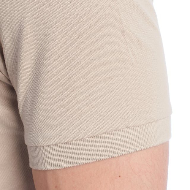 Inspired by the brand's sporting heritage, this US Polo Assn. polo offers a perfect blend of tradition and modernity. Designed for the man who values authenticity, its impeccable cut and embroidered details make it a contemporary wardrobe staple.

 Details:
 - Classic polo-style collar with two-button placket.
 - Short sleeves.
 - Piping detail on the inside of the neck.
 - US Polo Assn. logo embroidered on the chest.
 - Regular cut that guarantees comfort and freedom of movement.
 - High quality breathable piqué fabric.

 At US Polo Assn., every garment tells a story of authenticity, tradition, and sporty style. This men's polo shirt isn't just a staple: it represents the official heritage of the sport of polo and reflects our passion for quality, design, and casual elegance. Dress with identity, dress with history.
 Composition: 100% Cotton
 Care:
Machine wash cold (max. 30°C).
 Do not use bleach.
 Iron at low temperature if necessary.
 Air dry, avoid dryer.