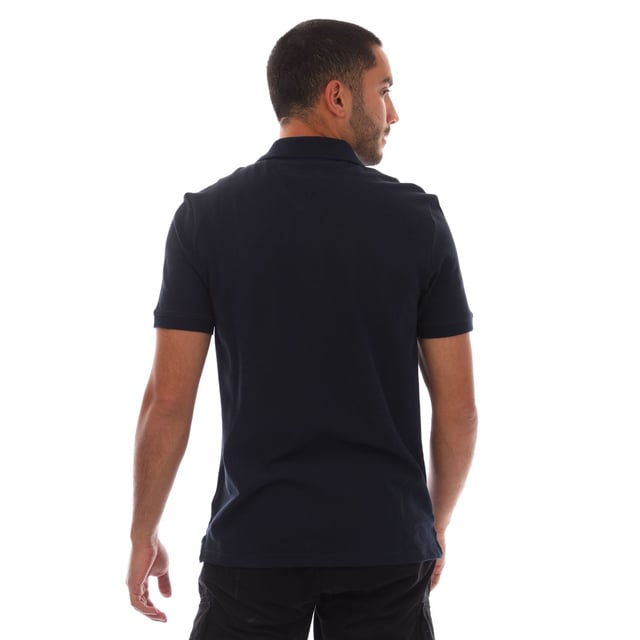 Mens Tommy Jeans Casual Polo Shirt in navy.- Ribbed polo collar.- Short sleeves with ribbed cuffs.- Two button placket.- Tommy Hilfiger flag embroidery on chest.- Split hem.- Regular fit.- 100% Cotton.- Ref.: DM0DM20763C1G