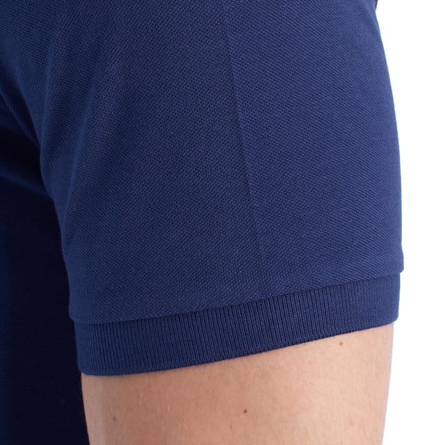 Inspired by the brand's sporting heritage, this US Polo Assn. polo offers a perfect blend of tradition and modernity. Designed for the man who values authenticity, its impeccable cut and embroidered details make it a contemporary wardrobe staple.

 Details:
 - Classic polo-style collar with two-button placket.
 - Short sleeves.
 - Piping detail on the inside of the neck.
 - US Polo Assn. logo embroidered on the chest.
 - Regular cut that guarantees comfort and freedom of movement.
 - High quality breathable piqué fabric.

 At US Polo Assn., every garment tells a story of authenticity, tradition, and sporty style. This men's polo shirt isn't just a staple: it represents the official heritage of the sport of polo and reflects our passion for quality, design, and casual elegance. Dress with identity, dress with history.
 Composition: 100% Cotton
 Care:
Machine wash cold (max. 30°C).
 Do not use bleach.
 Iron at low temperature if necessary.
 Air dry, avoid dryer.