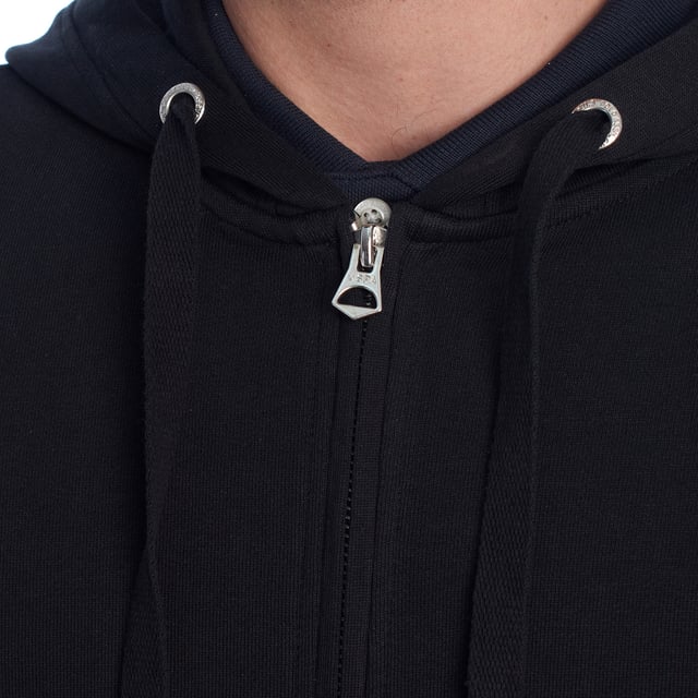 Designed for those who value functionality without sacrificing style, this US Polo Assn. zip-up hoodie combines comfort, contemporary design, and sporting heritage. Ideal for casual looks or light workouts, it adapts to the pace of everyday life with a timeless aesthetic.

 Details:
 - Full zip front closure.
 - Hood with adjustable contrasting drawstring.
 - Round neck.
 - Functional kangaroo pockets.
 - US Polo Assn. logo embroidered on the chest.
 - Soft and stretchy fabric, ideal for everyday use.
 - Ribbed cuffs and waistband.
 - Matching visible seams.

 At US Polo Assn., every garment reflects the authentic spirit of the sport of polo. This men's sweatshirt represents our commitment to quality, comfort, and classic style reinvented for the modern man.
 Composition: 100% Cotton
 Care:
Wash at maximum temperature 30º.
 Iron at low temperature.
 Do not use bleach.
 Do not use a dryer.
 Do not dry clean.