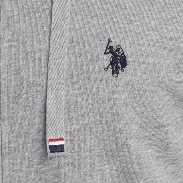 Designed for those who value functionality without sacrificing style, this US Polo Assn. zip-up hoodie combines comfort, contemporary design, and sporting heritage. Ideal for casual looks or light workouts, it adapts to the pace of everyday life with a timeless aesthetic.

 Details:
 - Full zip front closure.
 - Hood with adjustable contrasting drawstring.
 - Round neck.
 - Functional kangaroo pockets.
 - US Polo Assn. logo embroidered on the chest.
 - Soft and stretchy fabric, ideal for everyday use.
 - Ribbed cuffs and waistband.
 - Matching visible seams.

 At US Polo Assn., every garment reflects the authentic spirit of the sport of polo. This men's sweatshirt represents our commitment to quality, comfort, and classic style reinvented for the modern man.
 Composition: 100% Cotton
 Care:
Wash at maximum temperature 30º.
 Iron at low temperature.
 Do not use bleach.
 Do not use a dryer.
 Do not dry clean.