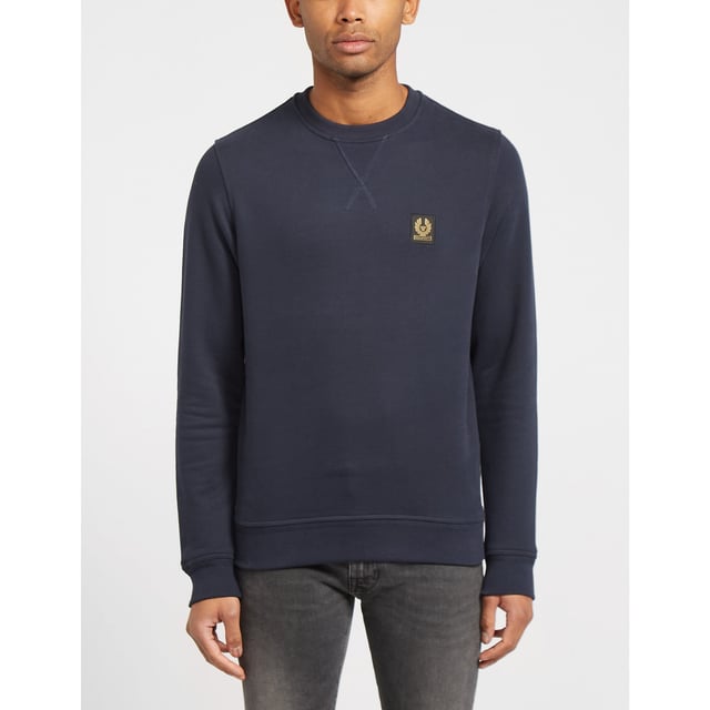 Tracing its roots back to 1909  seminal British label Belstaff infuse their pieces with their true spirit of adventure. They present this men's Patch Logo Sweatshirt which comes in a navy colourway and features an embroidered branding patch to the chest for a stylish staple sweatshirt. Details; navy colourway  ribbed crew neck  cuffs and hem  tonal stitching  regular fit and branding to the chest to complete.
