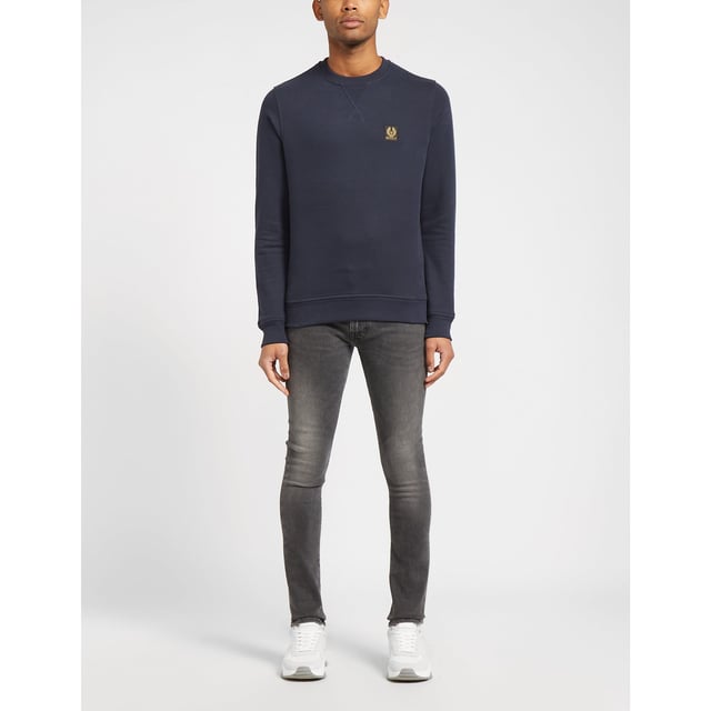 Tracing its roots back to 1909  seminal British label Belstaff infuse their pieces with their true spirit of adventure. They present this men's Patch Logo Sweatshirt which comes in a navy colourway and features an embroidered branding patch to the chest for a stylish staple sweatshirt. Details; navy colourway  ribbed crew neck  cuffs and hem  tonal stitching  regular fit and branding to the chest to complete.