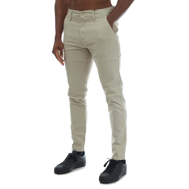 Mens Duck and Cover Moretor Chino Pants in stone.- Zip fly and button fastening.- Front slant pockets and inner coin pocket with tonal rubber print logo.- Rear welt pockets- Slim fit.- 98% Cotton  2% Elastane.  Machine washable.  - Ref: DC2B121588STN