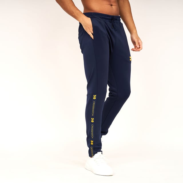 Mens Crosshatch Trackside Tracksuit in navy blueTrack top:- Drawcord-adjustable lined hood- Full zip fastening- Embroidered logo at left chest- Branded tape at sleeves- Side pocketsTrack pants:- Elasticated waist with drawcord- Side pockets- Rear pocket- Embroidered logo at left thigh- Branded tape at lower legs- 95% Polyester  5% Elastane.  Machine washable.- Ref: CH2Z119856AABLPlease note this style is sold as a set.  Returns will only be accepted if both items are returned together.