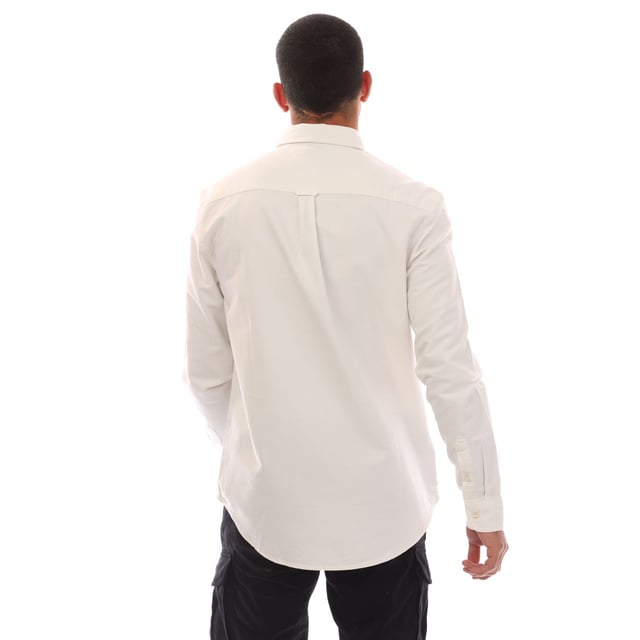Mens Tommy Jeans Regular Fit Button Down Oxford Shirt in ecru.- Button-down collar.- Long sleeves.- Rounded one-button cuffs.- Box pleat on back.- Rounded hem.- Tommy flag embroidery on chest.- Regular fit.- 100% Cotton.  Machine washable.- Ref: DM0DM21298YBL