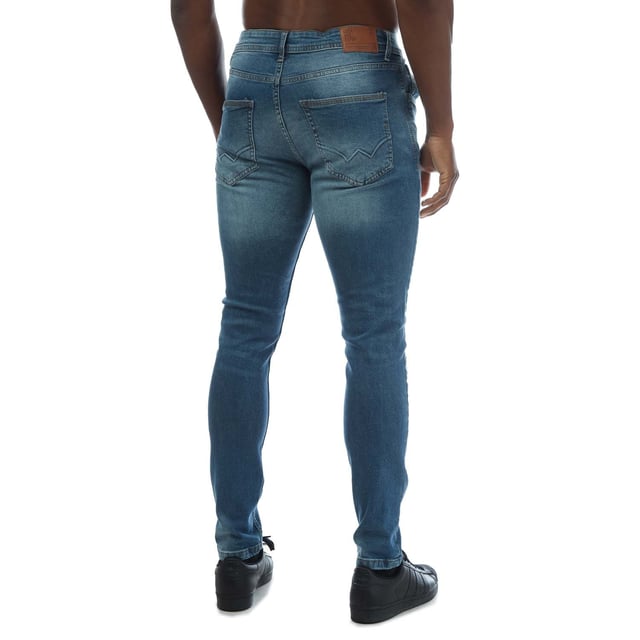 Mens Duck and Cover Doves Slim Fit Jeans in mid wash blue denim. - Classic 5-pocket construction. - Zip fly and button fastening. - Branded back waist patch.- Slim fit. - Short inside leg length approx. 30in  Regular inside leg length approx. 32in  Long inside length approx. 34in.- 98% Cotton  2% Elastane. Machine washable. - Ref: DC2B122666MWMeasurements are intended for guidance only.
