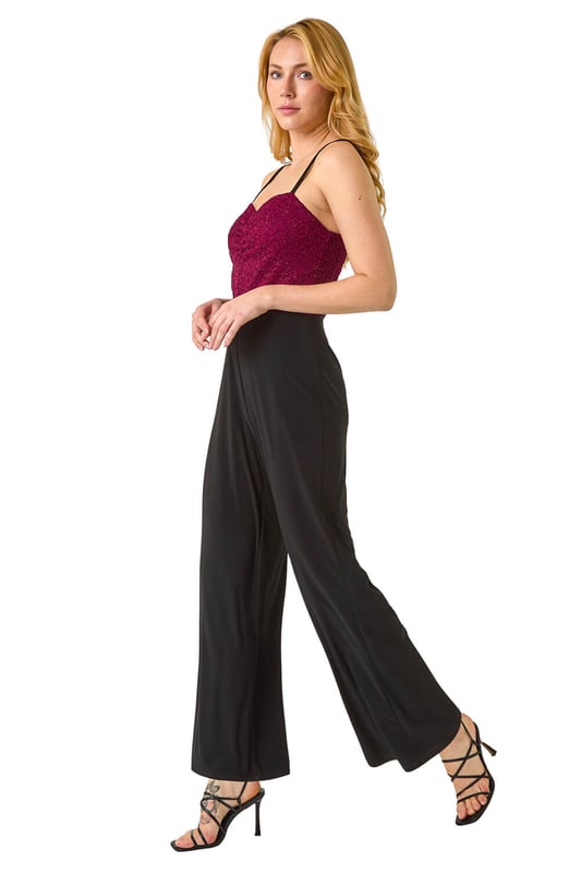 Dusk Sweetheart Lace Stretch Jumpsuit from Roman. Make a statement in our trendy jumpsuit, perfect for your next special event. Featuring a romantic sweetheart neckline with a delicate lace bodice, this full-length jumpsuit combines elegance with comfort. Crafted from stretch jersey fabric, this jumpsuit ensures a flattering fit. Pair with heels and a bolero for a sophisticated and stylish look that will surely turn heads!