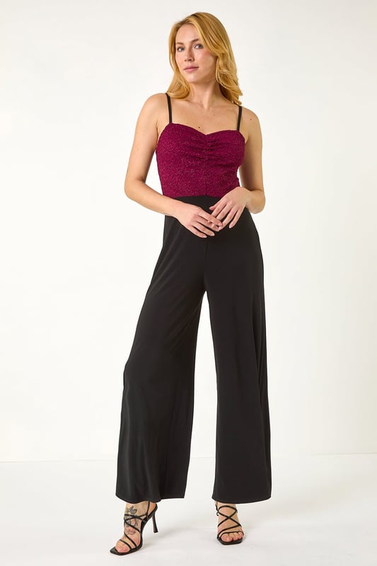 Dusk Sweetheart Lace Stretch Jumpsuit from Roman. Make a statement in our trendy jumpsuit, perfect for your next special event. Featuring a romantic sweetheart neckline with a delicate lace bodice, this full-length jumpsuit combines elegance with comfort. Crafted from stretch jersey fabric, this jumpsuit ensures a flattering fit. Pair with heels and a bolero for a sophisticated and stylish look that will surely turn heads!