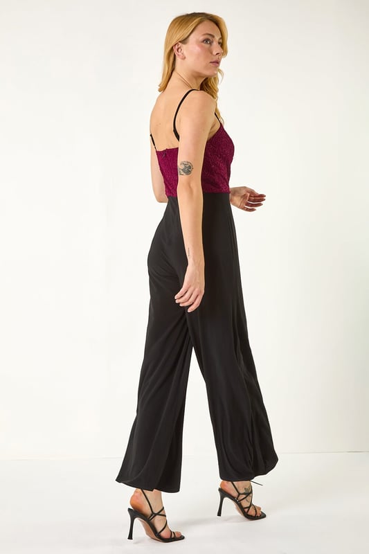 Dusk Sweetheart Lace Stretch Jumpsuit from Roman. Make a statement in our trendy jumpsuit, perfect for your next special event. Featuring a romantic sweetheart neckline with a delicate lace bodice, this full-length jumpsuit combines elegance with comfort. Crafted from stretch jersey fabric, this jumpsuit ensures a flattering fit. Pair with heels and a bolero for a sophisticated and stylish look that will surely turn heads!