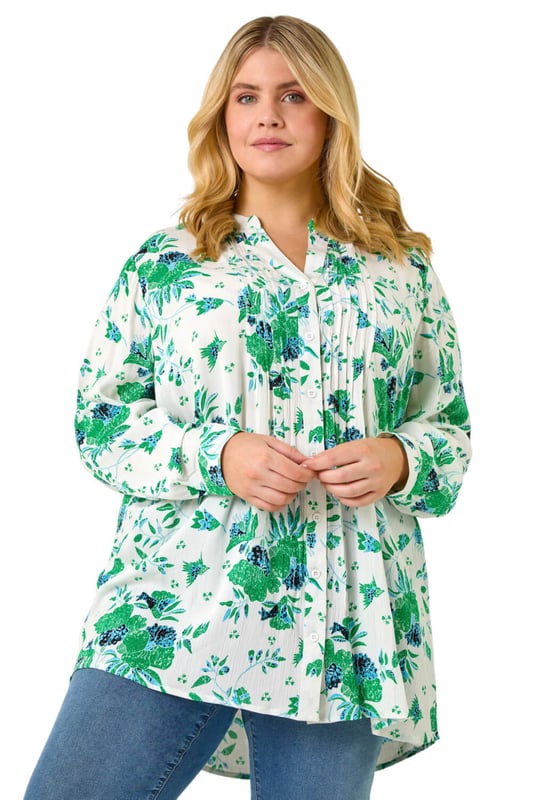 Curve Floral Print Pintuck Blouse from Roman. Add a touch of floral charm to your Spring Summer wardrobe with this gorgeous Curve pintuck blouse. The smart v-neckline and intricate pintuck detail create an elegant look. Crafted from a comfortable crinkle woven fabric in a beautiful floral print, this blouse features long sleeves and front buttons. Perfect for everyday wear, style with a denim jacket and jeggings for a completely stylish outfit!